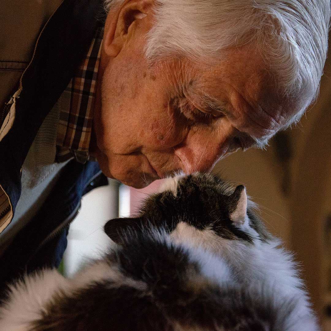 A senior with a small dog